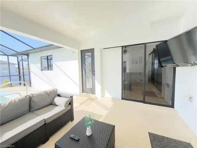 View of patio / terrace featuring a sunroom, glass enclosure, and outdoor lounge area