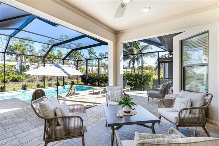 Fully screened, extended covered lanai, outdoor lounge area, a sunroom, pool