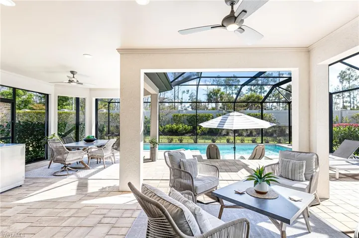 Full view outdoor living & dining lanai perfect for entertaining, and outdoor pool