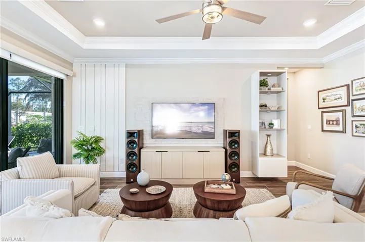 Living room featuring meadia wall & built-in
