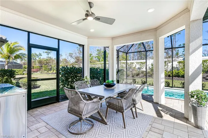 Large outdoor dining area overlooking the pool