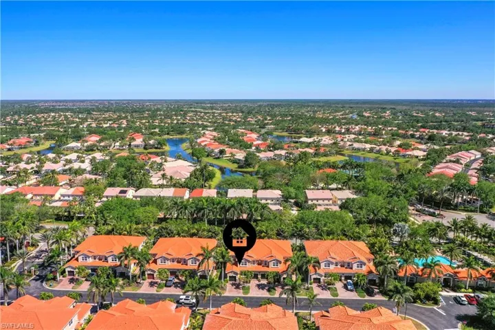 Birds eye view of property with a residential view and a water view