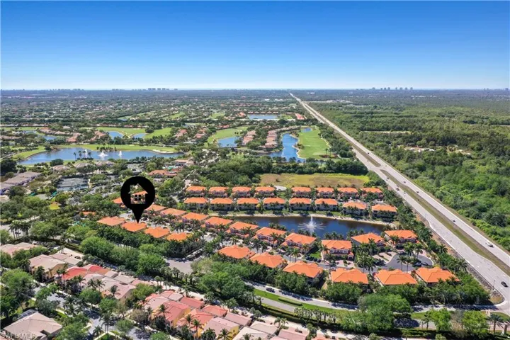 Drone / aerial view featuring a water view and a residential view