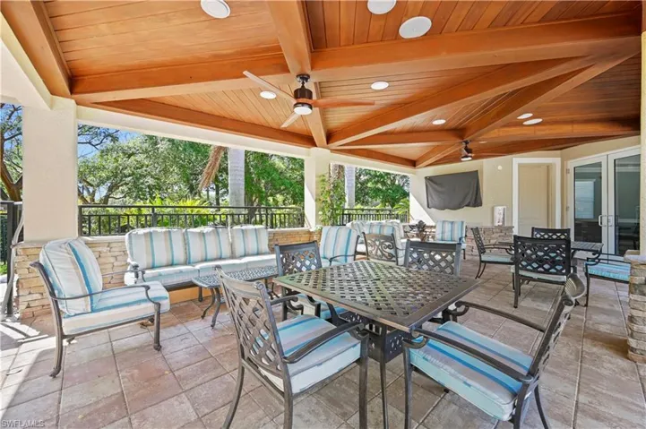 View of patio / terrace featuring outdoor dining area, an outdoor hangout area, and a ceiling fan