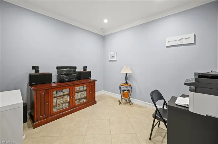 Home office with light tile patterned floors, recessed lighting, baseboards, and ornamental molding