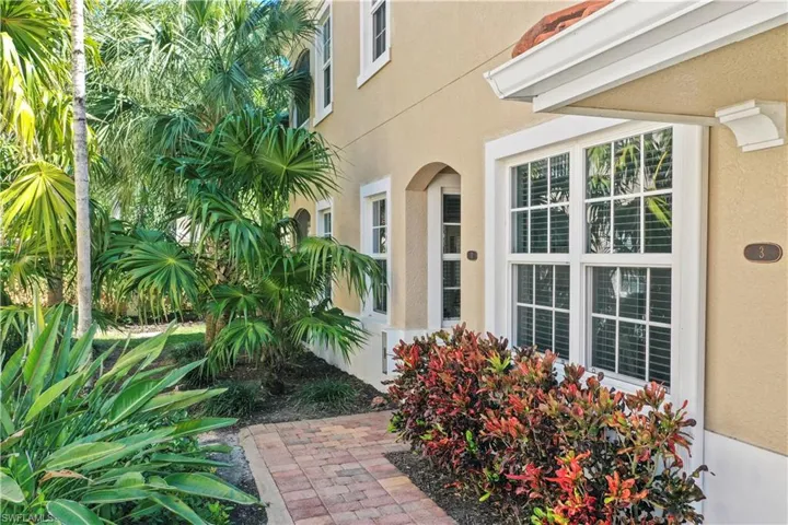 Property entrance with stucco siding
