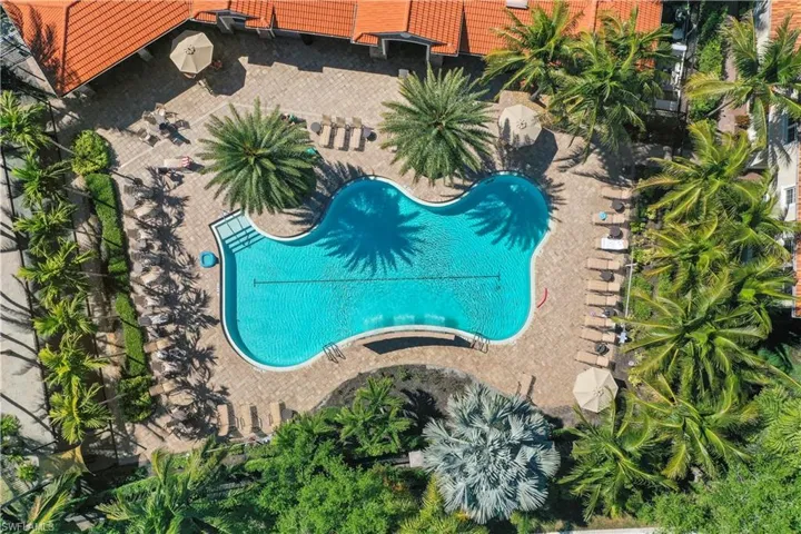 Bird's eye view of community pool, clubhouse, and fitness center