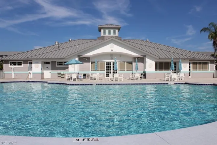 Community pool featuring a patio