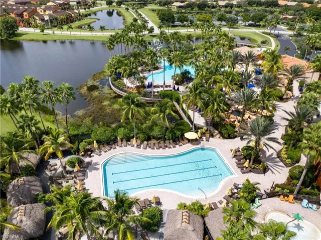 View of swimming pool with a patio area and a water view