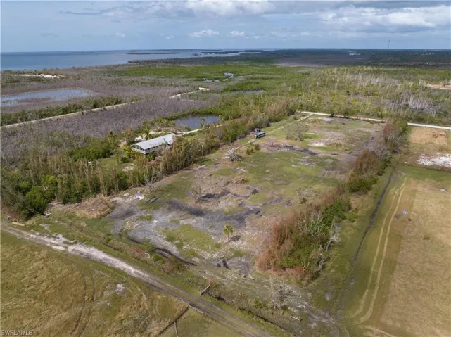 Aerial overview of property's location featuring a nearby body of water