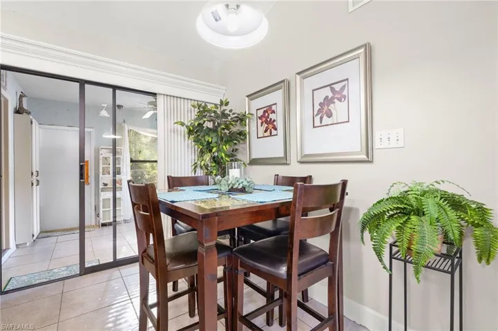 Dining room with light tile patterned flooring