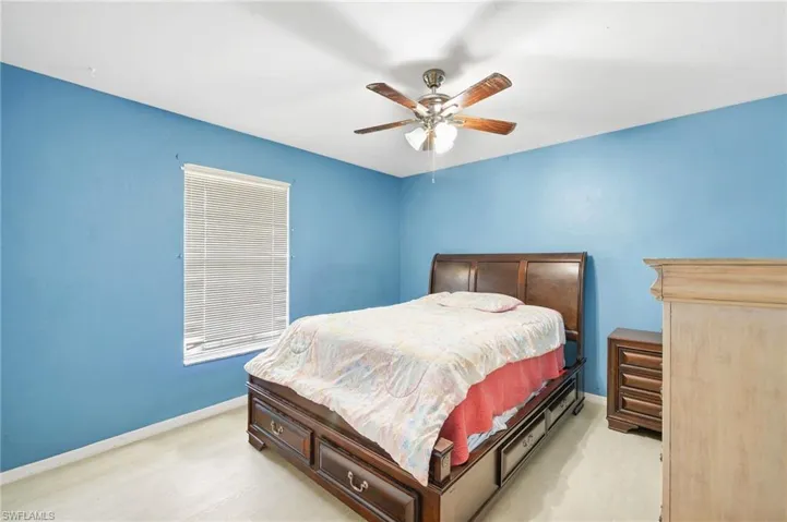 Bedroom with baseboards and a ceiling fan