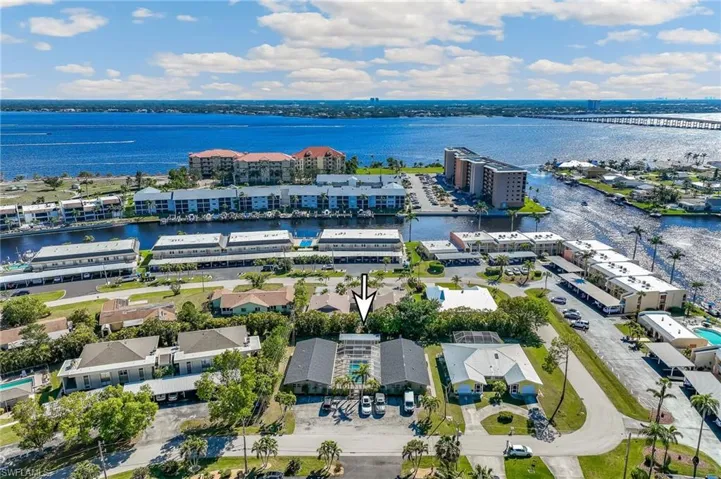 Birds eye view of property featuring a water view and a view of Jaycee Park