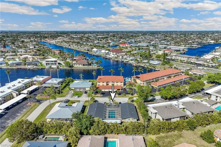 Birds eye view of property featuring a residential view and a water view