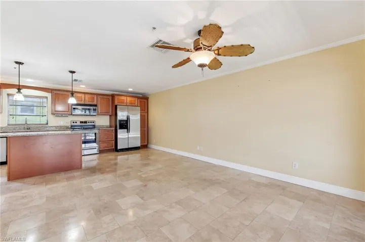 The Captiva unit lving room area with tile floors, and crown molding