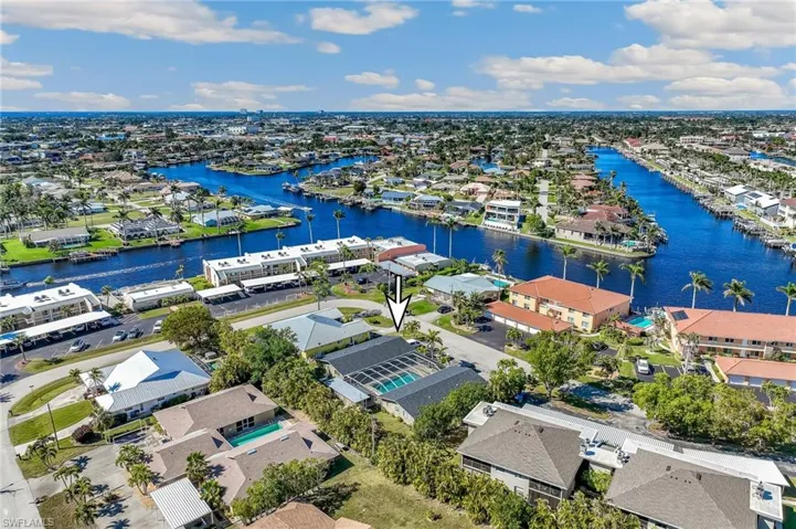 Aerial view featuring a residential view and a water view