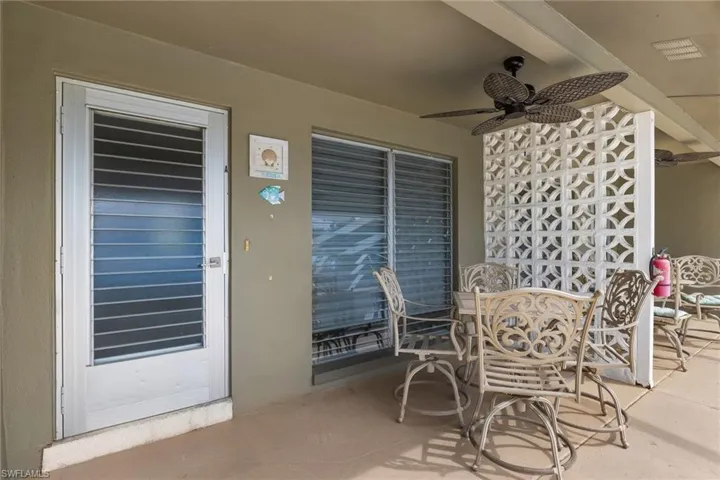Aruba Unit View of patio with a ceiling fan.