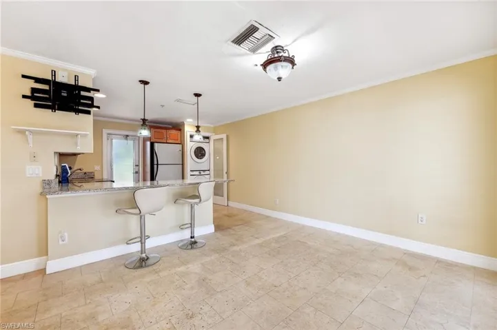 The Aruba unit living area off the kitchen with tile floors.