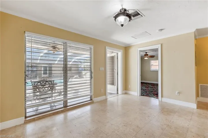 The Aruba unit living area with front entry and tile floors and crown molding