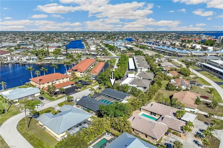 Bird's eye view with a water view and a residential view