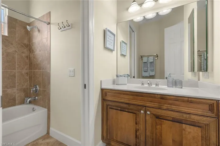 Bathroom featuring shower/tub combo can be closed off with pocket door for privacy