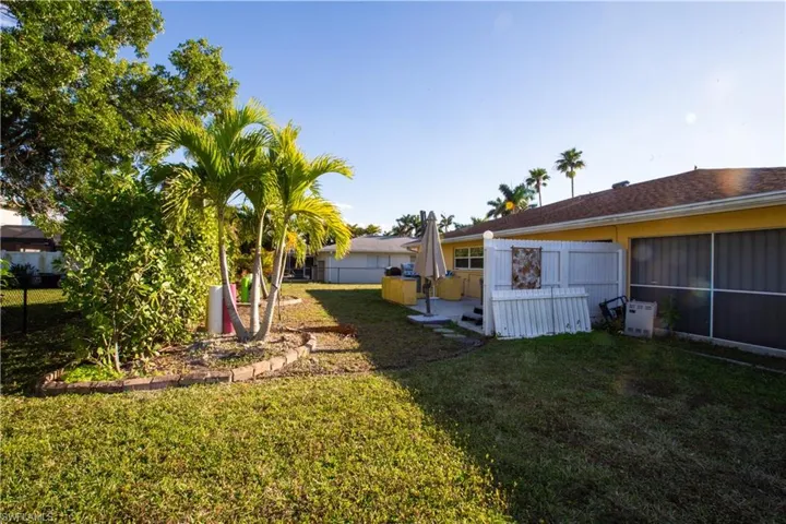 View of yard featuring fence