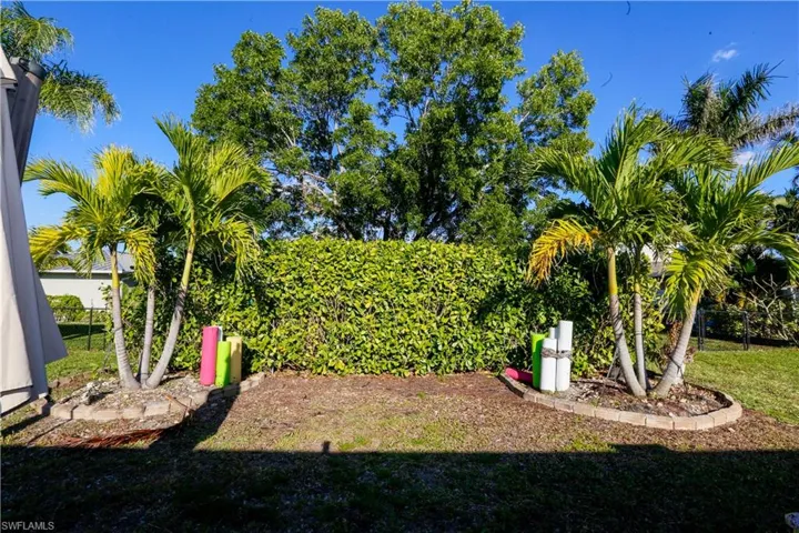 View of yard featuring fence