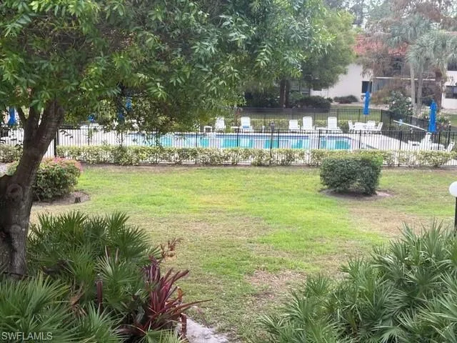View of yard with a community pool