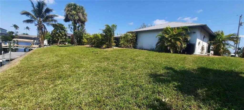 View of yard with a dock