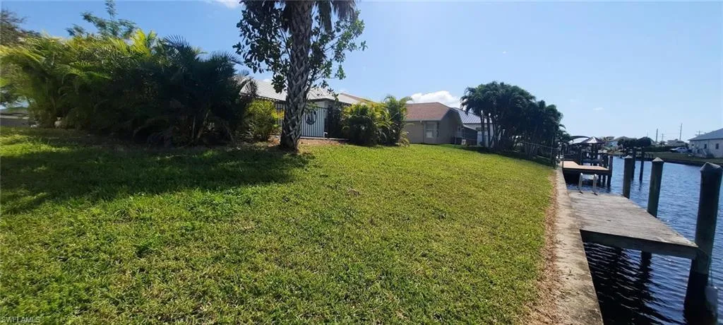 View of yard with a dock