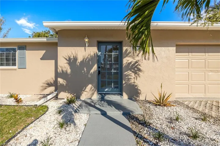 Property entrance featuring a garage