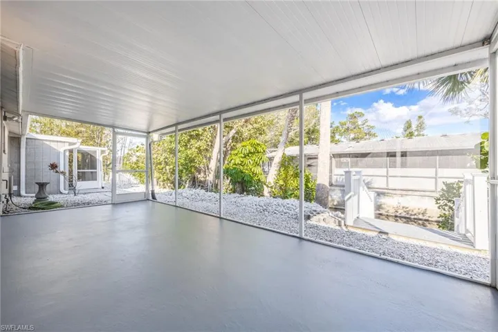 Unfurnished sunroom featuring a wealth of natural light