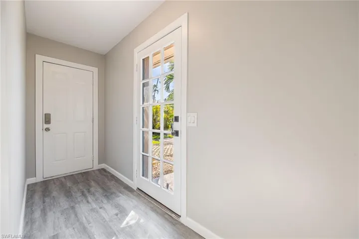 Doorway to outside featuring light wood-type flooring