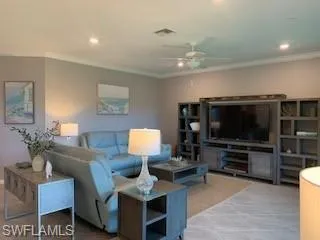 Living room featuring crown molding