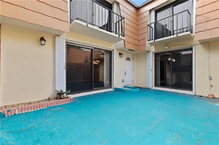 View of swimming pool with a balcony and a patio area