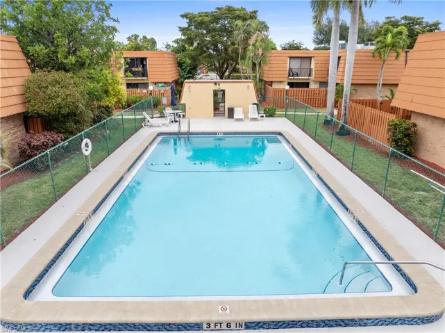 Community pool featuring a patio area