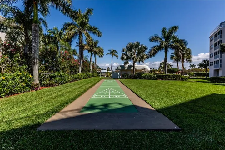 View of nearby features with a lawn