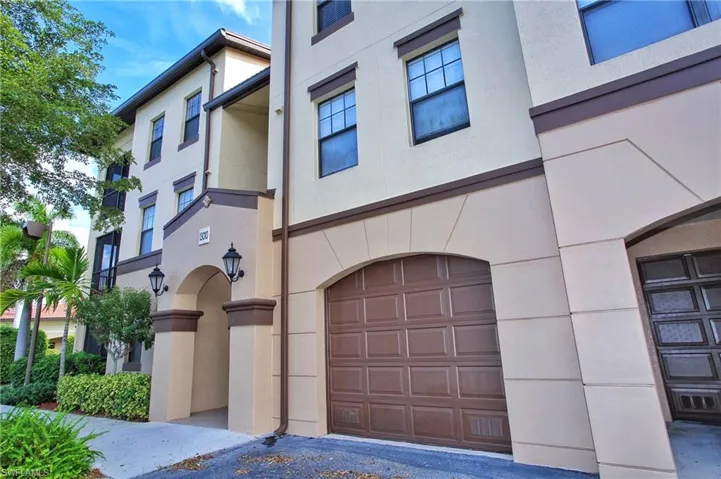 View of property featuring a garage
