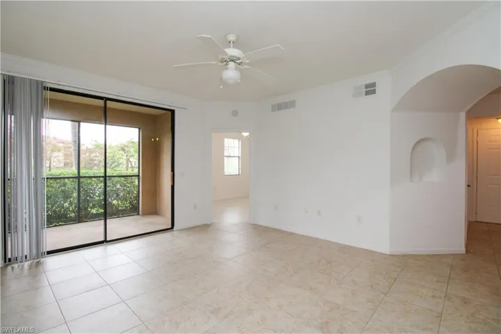Unfurnished room featuring ceiling fan and crown molding