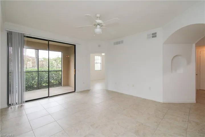 Unfurnished room featuring ceiling fan and crown molding