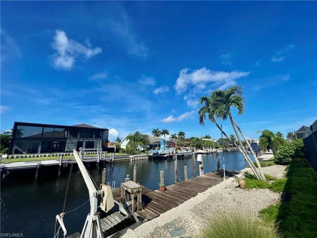 Dock area featuring a water view and a lanai
