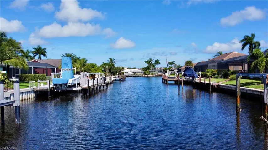 Property view of water featuring a dock