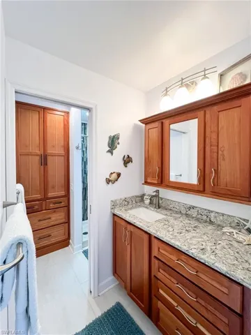 Bathroom with tile flooring and vanity