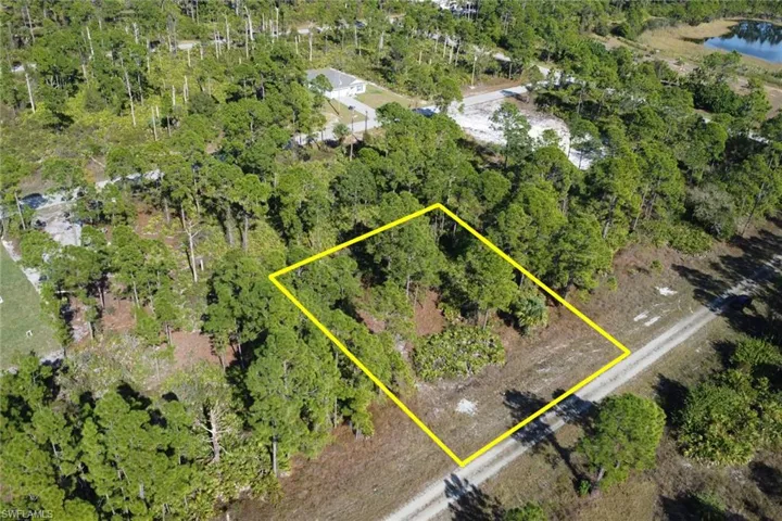 Aerial overview of property's location featuring property parcel outlined