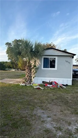 View of property exterior featuring a yard
