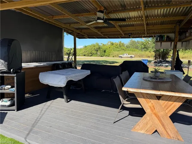 Deck with ceiling fan and outdoor dining space