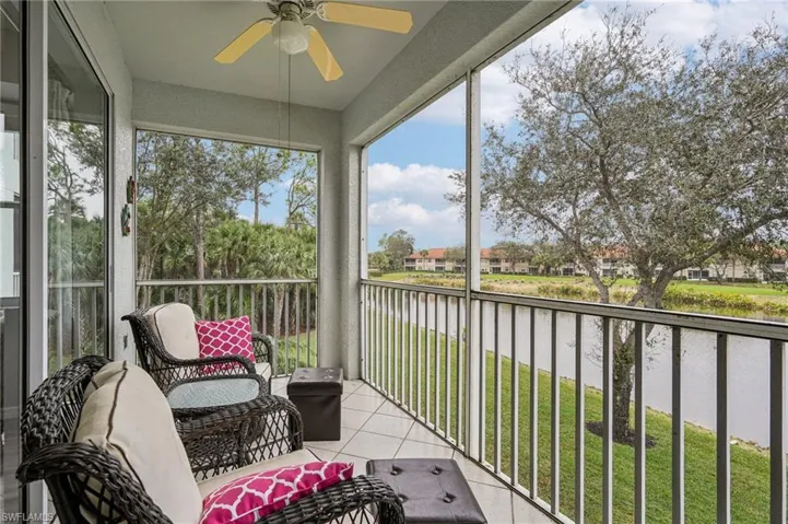Sunroom with a water view, ceiling fan, and plenty of natural light