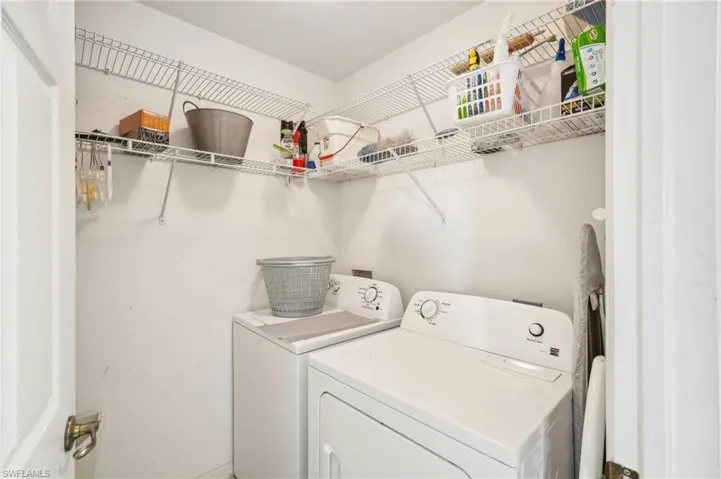 Laundry room with washer and clothes dryer