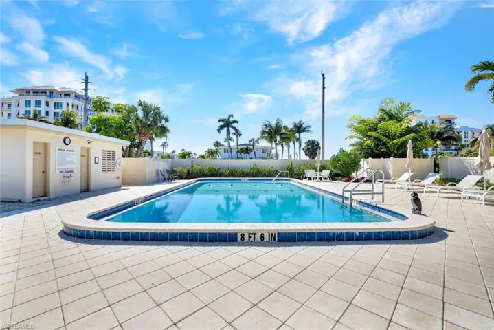 Community pool with a patio area