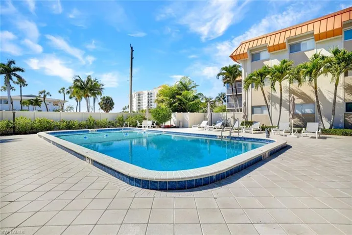 Community pool featuring a patio area